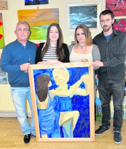 Amanda Murphy, student displaying her Tango Dancers pictured with her family members, Eddie, Emma and Edward. G Mol Le Chéile VTOS Shanagolden Art Exhibition at NCW Library