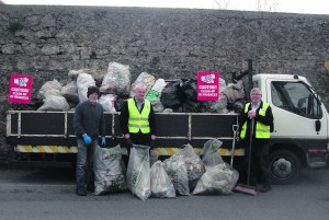 Tidy town members removing rubbish after clean-up John Tierney, Jim Cauldfield and Ben O'Sullivan