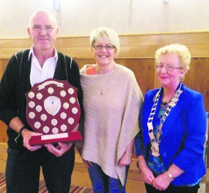 Speakeasy Toastmaster of the Year Sean Corcoran pictured holding the Jerry mulcahy Memorial trophy, with Jerry's daughter Mary O'Sullivan, and Toastmasters President Marie Lynes.