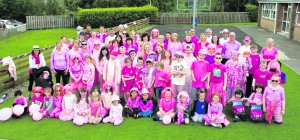 Grandparents, parents and pupils all dressed in pink pictured last Thursday prior to the 5k walk. - Wacky Pink Day -- Photo by Paul Ward -