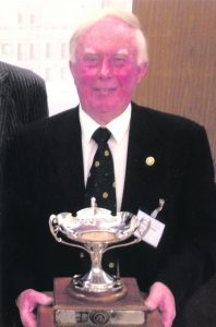 Gerry Callanan of the Rotary loub of Mallow proudly holds the cup after the Ireland and Scotland team which he captained won the Rotary Club of St Andrew's International Golf Tournament.