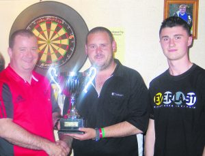 Mick Davitt and son Colin presenting the Breda Davitt Memorial Cup to Nicky Sherman.