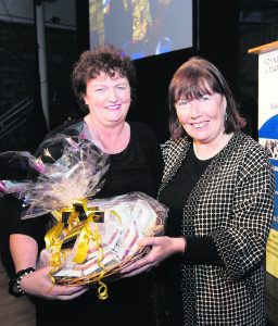 REPRO FREE 24/10/16 Imelda O'Connor, Foynes is presented with Maureen O'Hara inspired Jewellery from Tipperary Crystal by Norma Prendiville. The Golden Age of Hollywood lit up the Foynes Flying Boat and Maritime Museum as the fashion and style of Hollywood star Maureen OÕHara was revealed to the public for the first time in a spectacular gala event. The event, the first in a line of fundraisers to construct the new Maureen OÕHara Blair wing of the museum, was officially opened by the Minister of State for Tourism and Sport Patrick OÕDonovan. Minister OÕDonovan gave his commitment to supporting the project that is expected to significantly increase the 60,000 visitor numbers to the poplar west Limerick tourist attraction. Owing to the generosity of Ms OÕHaraÕs grandson Conor Fitzsimons, the worldÕs largest collection of Ms OÕHaraÕs memorabilia will go on display in Foynes on completion of the new phase of the museums structure. Picture: Sean Curtin True Media.