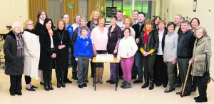 Group with the Celebration Cake on the opening of the Memorial Garden. Photo by Paul Ward. Paul Ward Memorial Garden Opening at Colaiste Ide agus Iosef