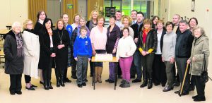 Group with the Celebration Cake on the opening of the Memorial Garden. Photo by Paul Ward. Paul Ward Memorial Garden Opening at Colaiste Ide agus Iosef