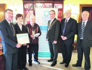 Cork Carer of the Year Patrick Moloney, with Deputy County Mayor Ian Doyle, Patrick's daughter Colette, Lord Mayor of Cork Des Cahill, Peter Cox Area Manager FCI, and Pat Grogan Regional Manager FCI.